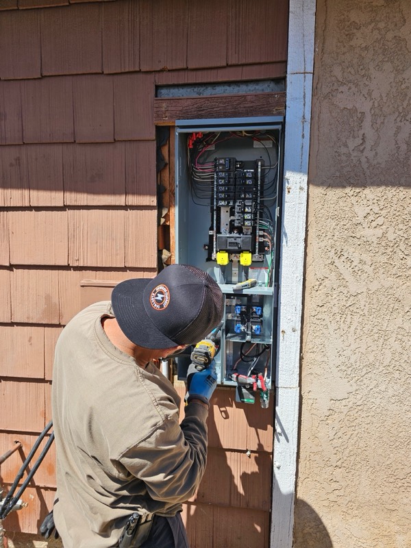 Electrician working on a residential panel