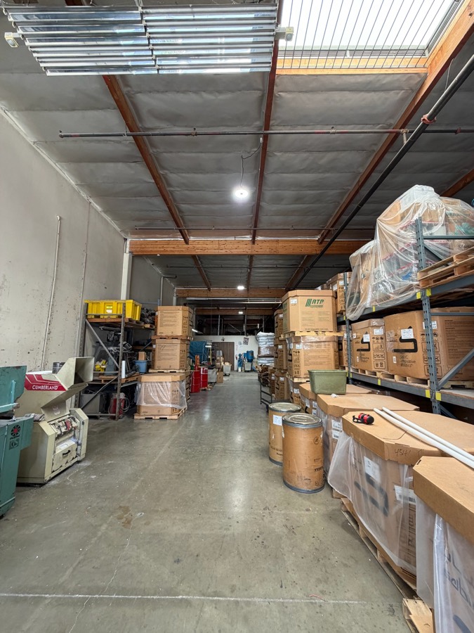 Warehouse interior with overhead lighting