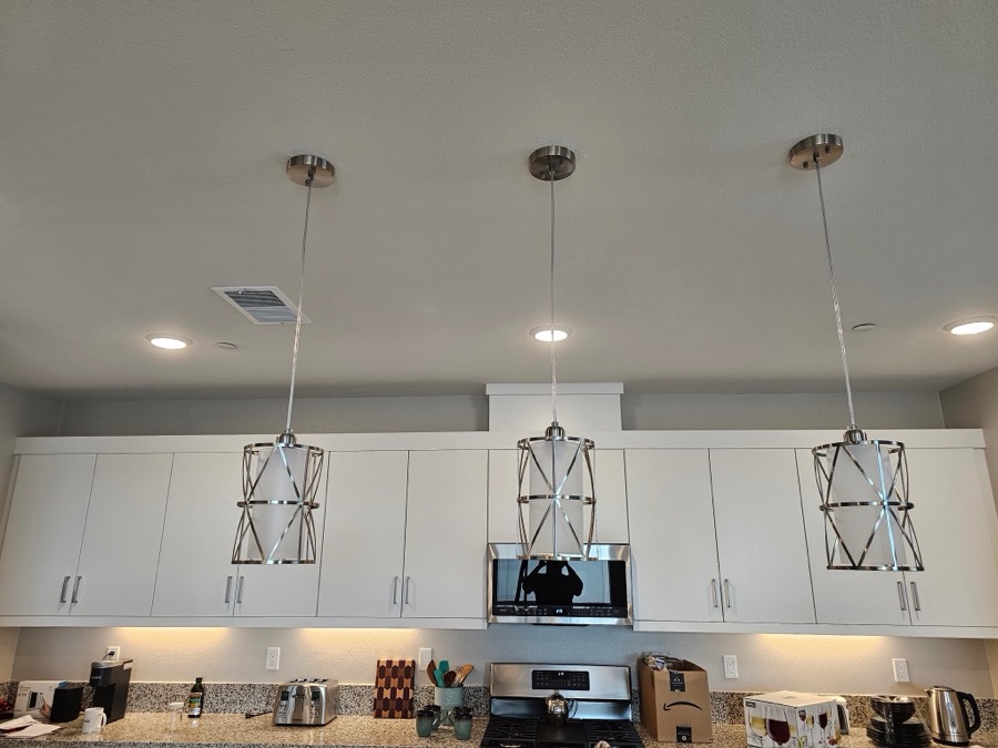 Pendant lighting installed over a kitchen counter